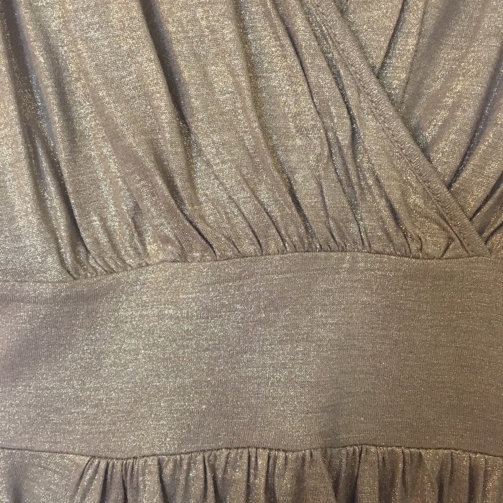 Gold Calvin Klein sleeveless top.